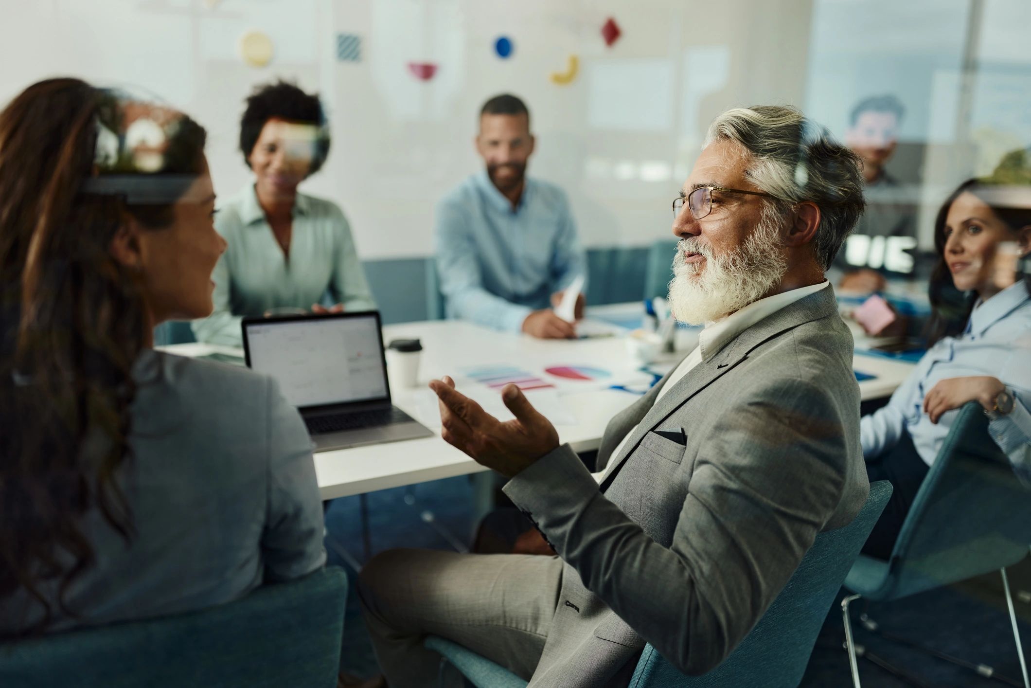 Consultant speaking with a colleague in a modern office