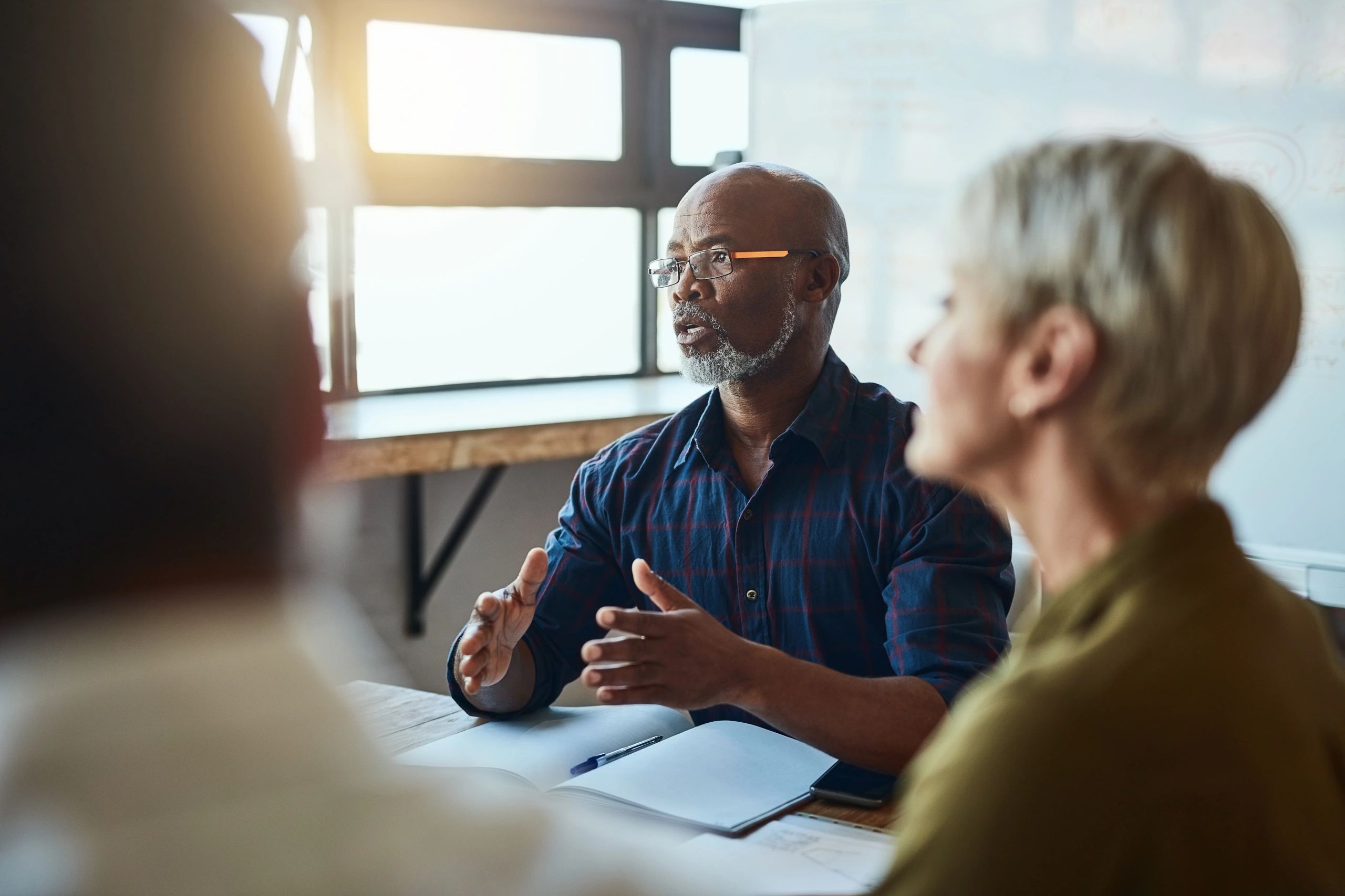 Business colleagues discussing plans during an office meeting